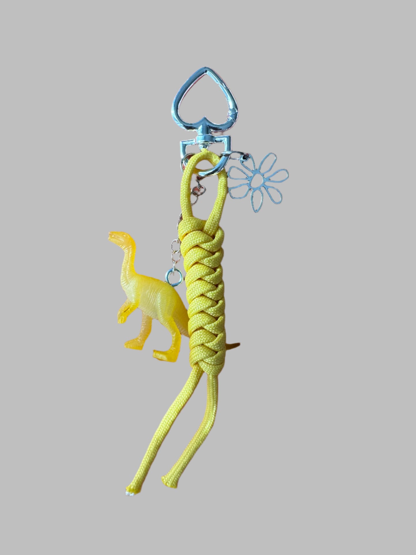 Yellow Dino and yellow cord with silver flower